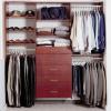 A Typical Design for a Man's Closet with Drawers and Wood finish.